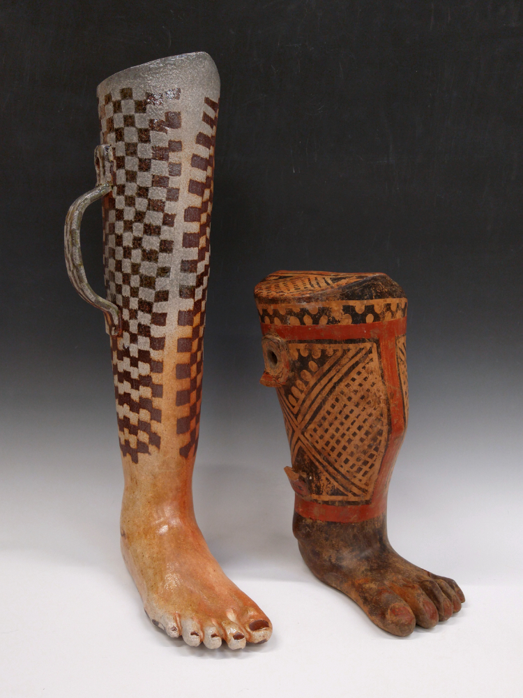 This piece by artist Isa Rodriguez shows a contemporary ceramic sculpture of the artists leg shown side-by-side with a pre-columbian leg-shaped ceramic effigy vessel.